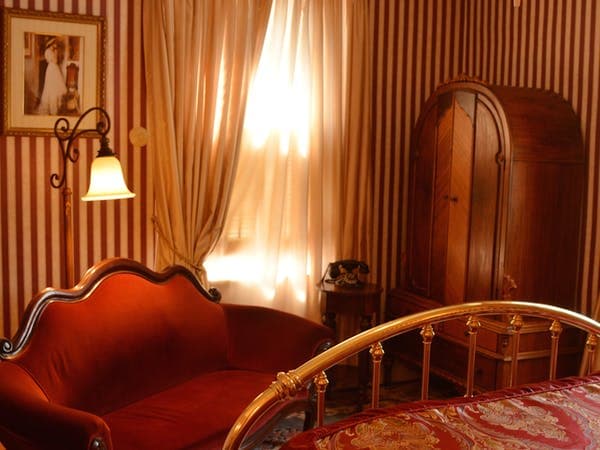 Romantic Comfy Sitting Area with Antique Armoire